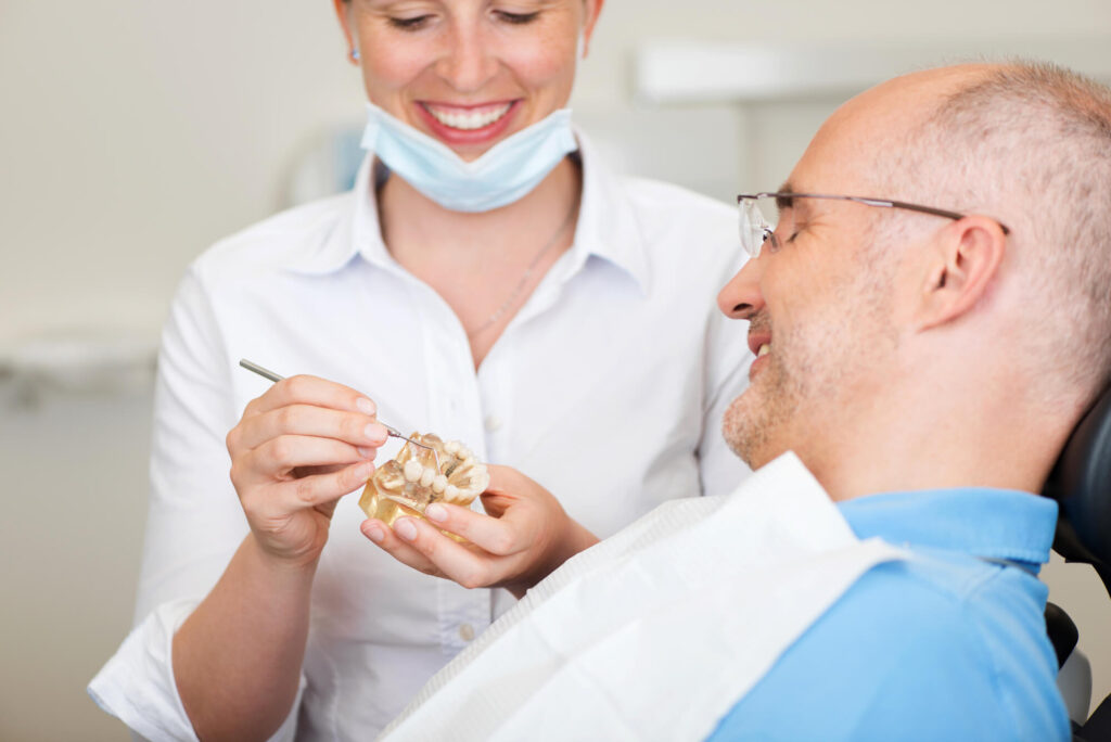 patient and dentist in Denver discussing dental implants